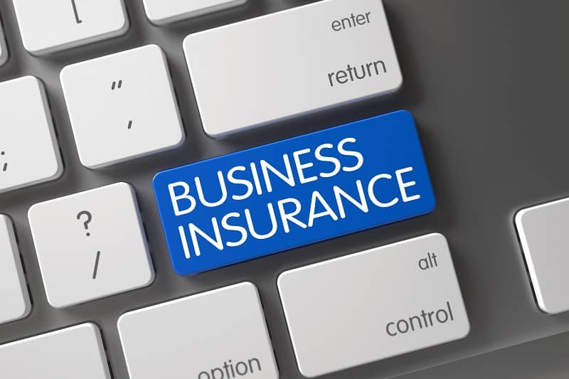 "Business insurance" written on a keyboard