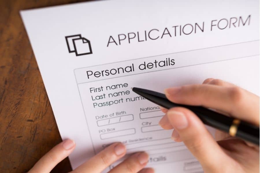 Human hand filling application form