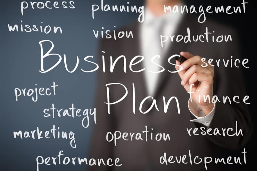 business man writing business plan concept