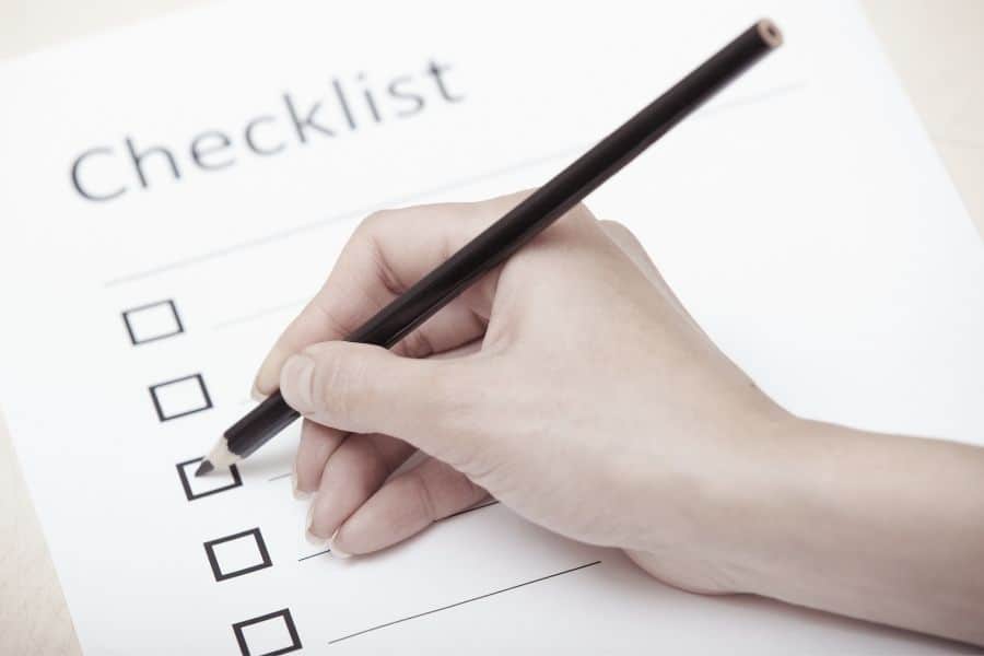 Hand writing on a checklist document for daily planning