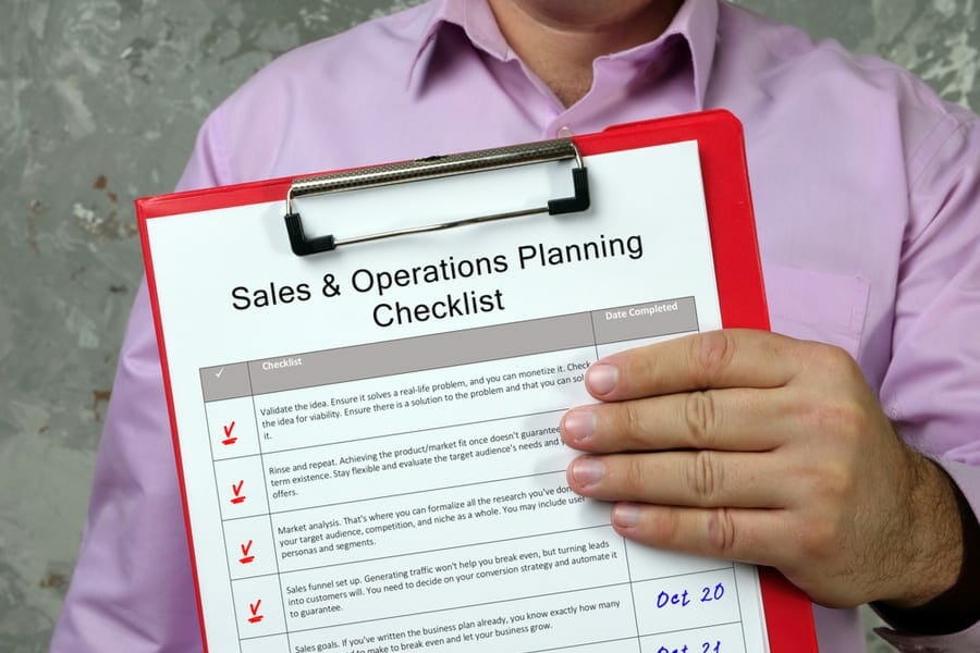 Sales and Operations Planning Checklist inscription on the piece of paper.