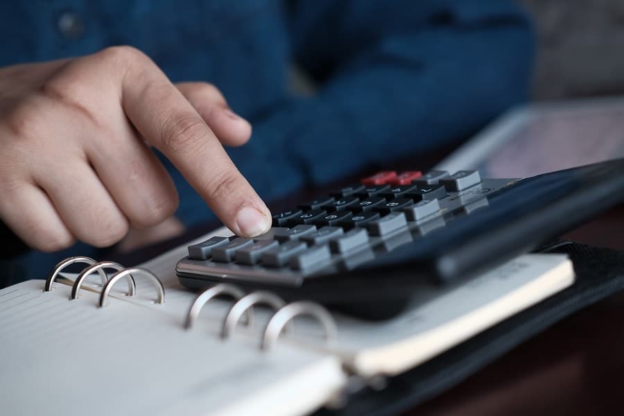 businessman using calculator in tax state