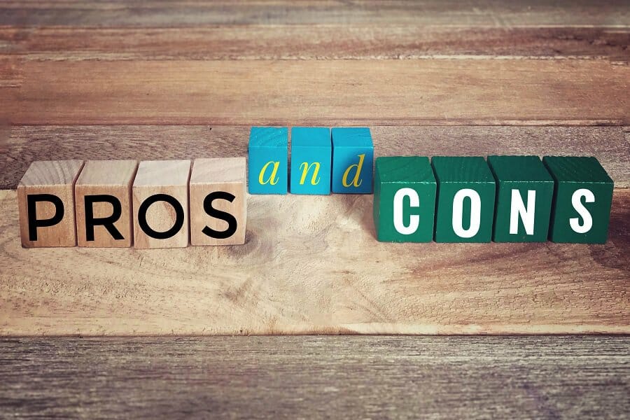 pros and cons concept written on wooden blocks