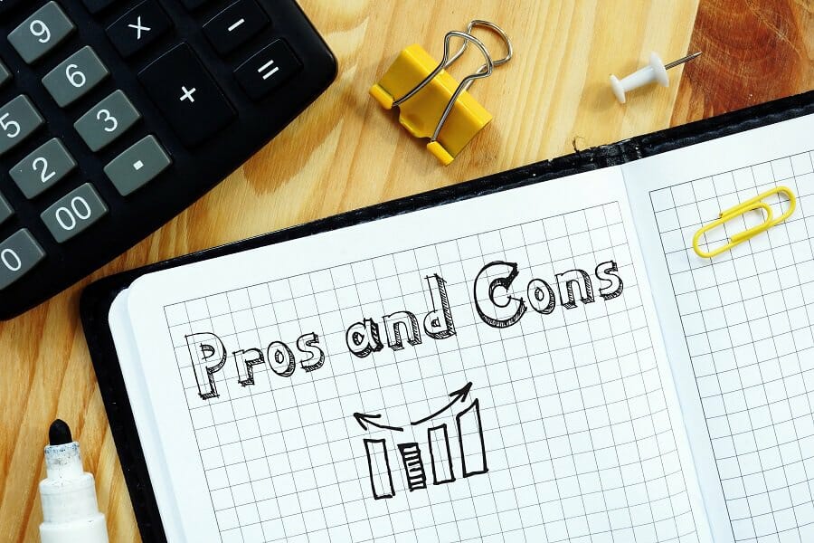 pros and cons written on the page business concept