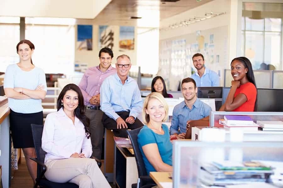 business people smiling while sitting in the modern office