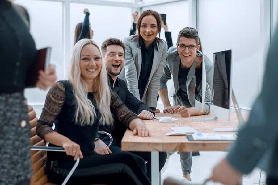 business people smiling while working together in the office