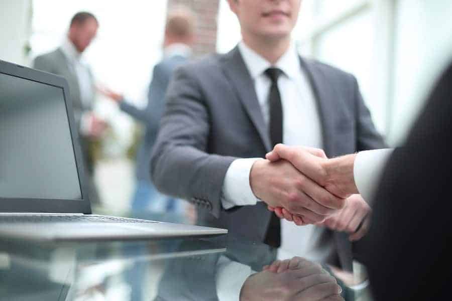 businessman shaking hands with the client