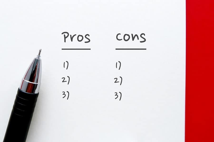 pros and cons written words with pen concept