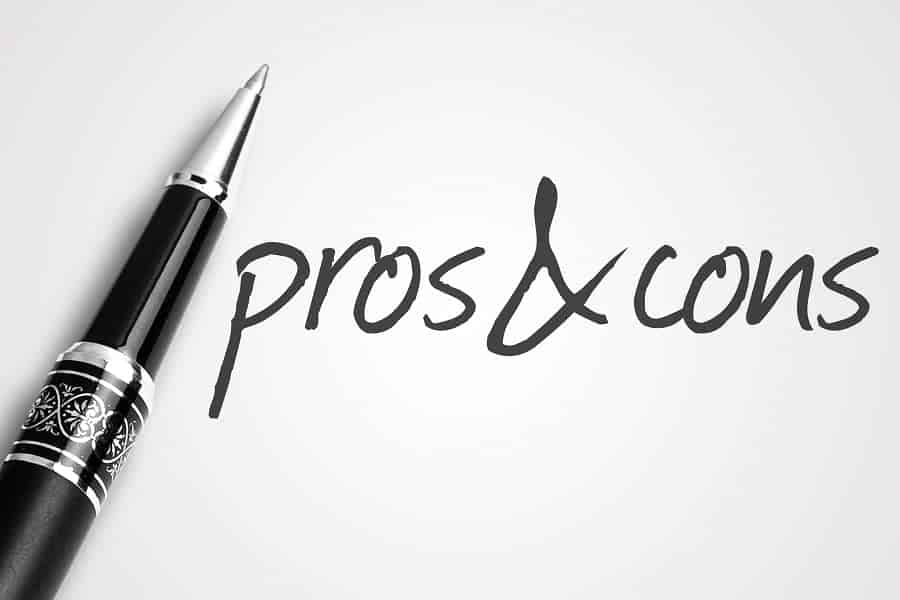the pros and the cons written with pen business concept