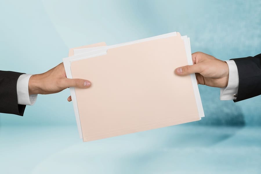 business people handing paper file folder