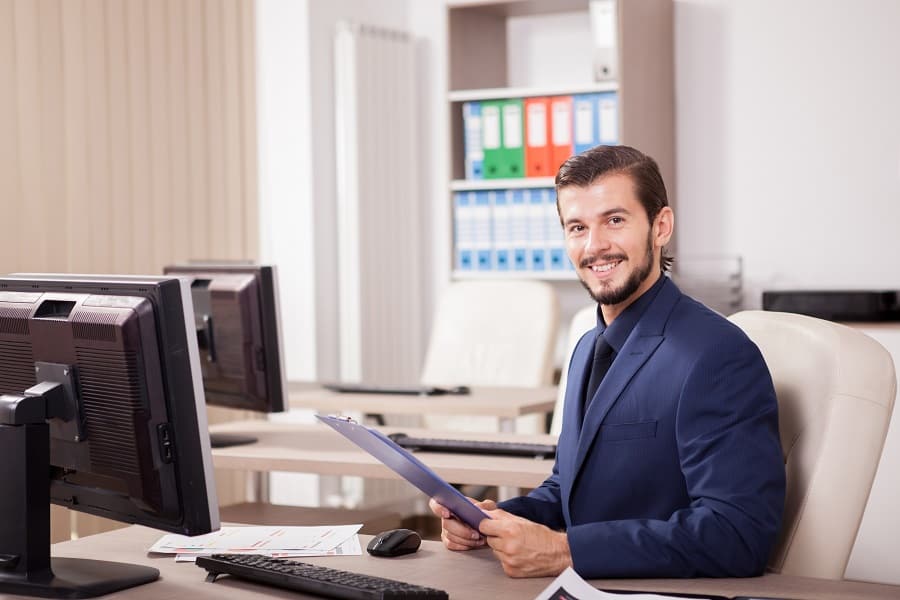 handsome employee working in a office desk