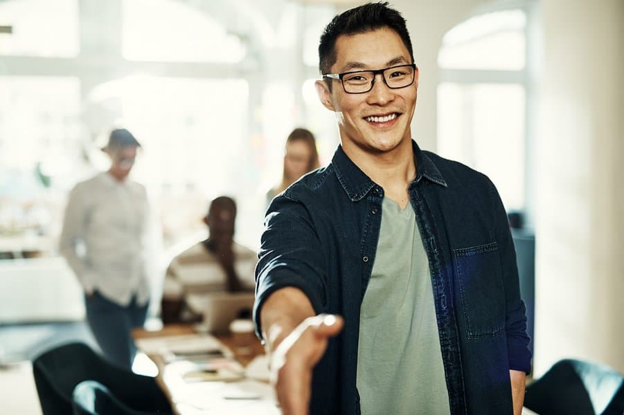 businessman extending a handshake