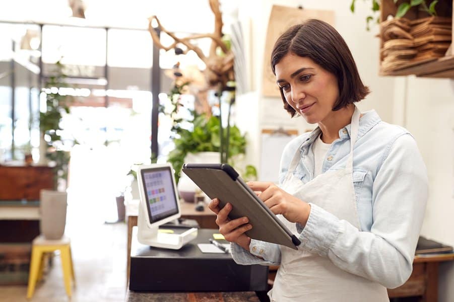 businesswoman standing in her own store