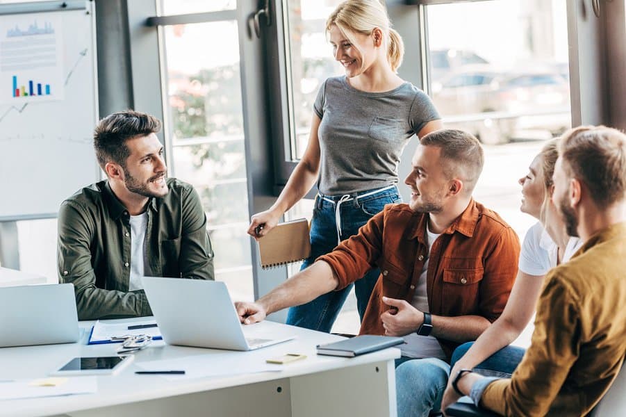 entrepreneurs talking while working on startup together